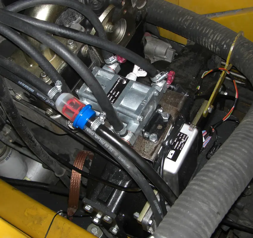 DFM D fuel flow meter installed in a machine engine compartment DFM D fuel flow meter installed in a machine engine compartment